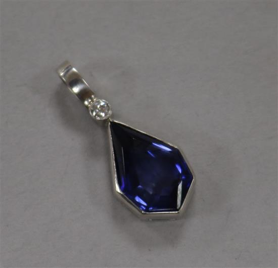 A white metal, synthetic sapphire and diamond set pendant, 20mm.